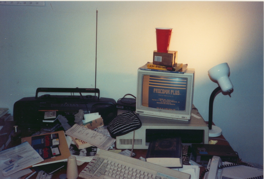 IBM XT Running Procomm Plus. My First Computer, with a boom box and a book of poetry.