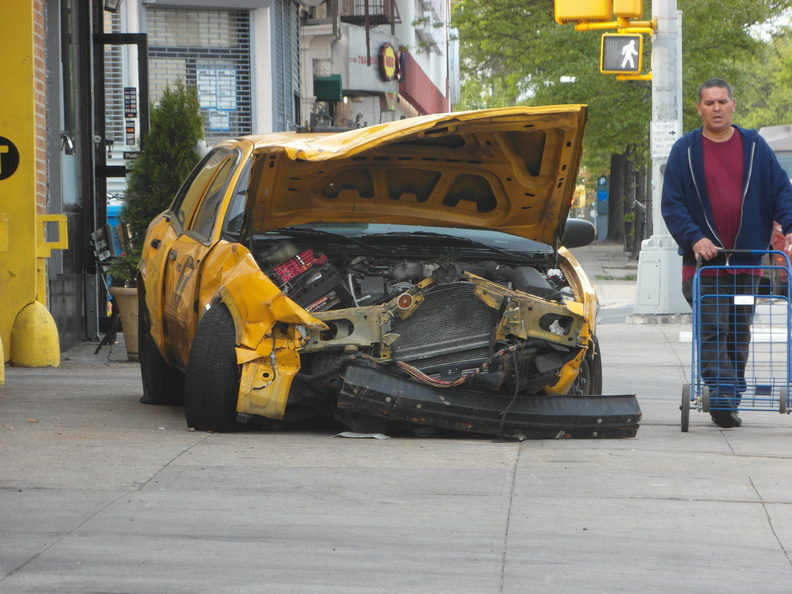 Sad, defeated old taxi cab on Steinway Street.