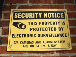 T.V. Cameras and Alarm System Are On 24 Hrs. a Day
