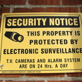 T.V. Cameras and Alarm System Are On 24 Hrs. a Day
