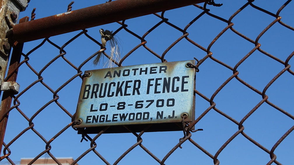 Another Brucker Fence. LOwell-8-6700.