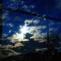 Sun and Clouds Reflected in a Bus Shelter DSC05264