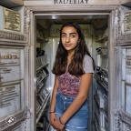 Teenage-girl-living-inside-a-family-mausoleum-at-Old-Calvary-Cemetery-in-Queens,-New-York.-Her-mausoleum-niche-is-actually-a-freezer. (1)