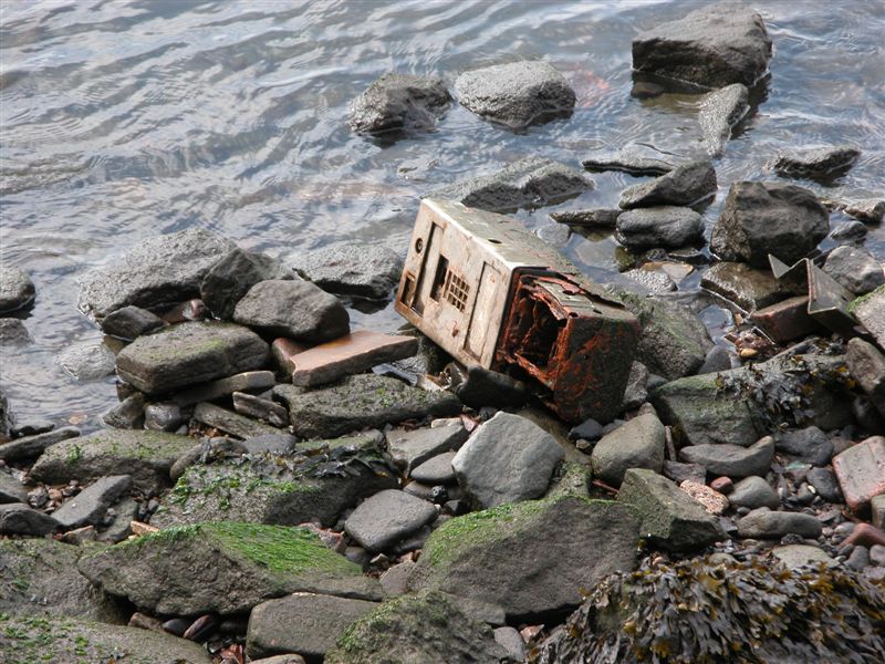 Discarded Payphone. East River. August 11, 2003.